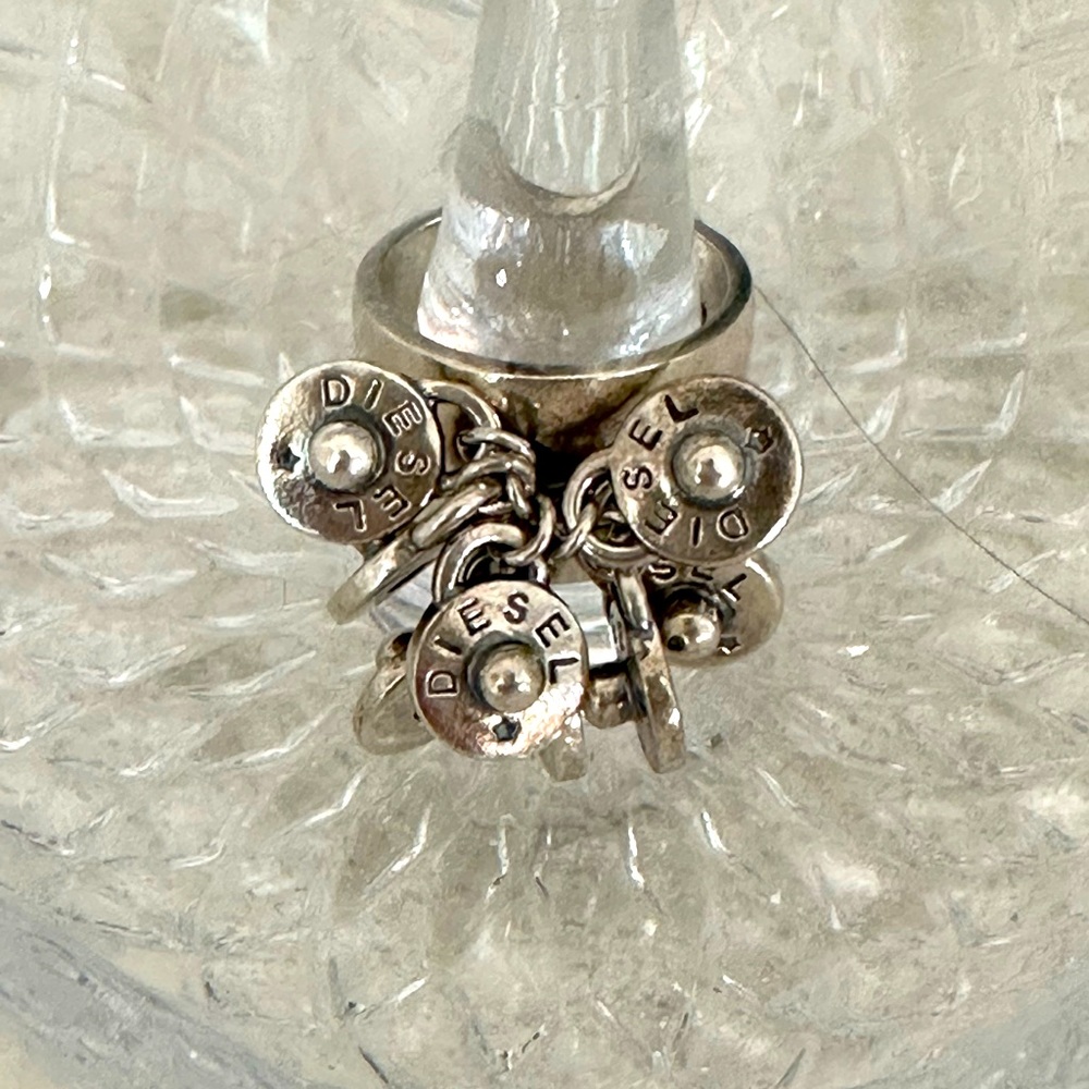 Diesel rivet ring , Silver Size 7 with 8 rivets ,5/8 tapering to 3/8” wide.